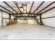 Spacious garage with high ceilings, steel beams, and ample room for storage and workshop activities at 5529 W Mccord Rd, McCordsville, IN 46055