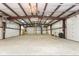 Expansive garage interior, featuring roll-up doors, tall ceilings and an abundance of open space at 5529 W Mccord Rd, McCordsville, IN 46055