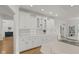 Spacious kitchen features custom white cabinets and glass door accents for an open and airy feel at 5529 W Mccord Rd, McCordsville, IN 46055