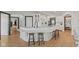 Modern kitchen features a large island with bar seating, perfect for casual dining and gathering with Gathering at 5529 W Mccord Rd, McCordsville, IN 46055