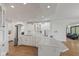 Bright kitchen boasts an open layout with white cabinets, island, and modern appliances, perfect for entertaining at 5529 W Mccord Rd, McCordsville, IN 46055