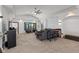 Relaxing living room area with large windows, neutral decor, and vaulted ceilings at 5529 W Mccord Rd, McCordsville, IN 46055