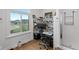 Bright home office featuring a large window, built-in shelves, and a functional workspace at 5529 W Mccord Rd, McCordsville, IN 46055