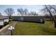 The large outbuilding features a high ceiling, ideal for storage or a workshop at 5529 W Mccord Rd, McCordsville, IN 46055