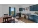 Versatile room with blue built-ins, desk space, and natural light, ideal for office or creative pursuits at 5529 W Mccord Rd, McCordsville, IN 46055