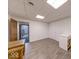 Finished basement space with wood-look flooring and a door leading to another part of the basement at 563 E Greencastle Rd, Mooresville, IN 46158