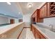 Basement wet bar features cabinets, countertops, stainless fridge, and view of the rec room at 563 E Greencastle Rd, Mooresville, IN 46158
