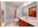 Full bathroom with tub/shower combo, neutral tile flooring, and solid wood vanity at 563 E Greencastle Rd, Mooresville, IN 46158