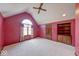 Large bedroom with vaulted ceilings, a window seat, and built-in shelving at 563 E Greencastle Rd, Mooresville, IN 46158