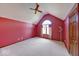 Large bedroom with vaulted ceilings, a window seat, and neutral carpet at 563 E Greencastle Rd, Mooresville, IN 46158