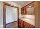 Butler pantry with granite countertops and custom cabinetry for storage and serving at 563 E Greencastle Rd, Mooresville, IN 46158