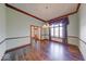 Dining room with beautiful natural light, chandelier, and wood trim offers an inviting atmosphere at 563 E Greencastle Rd, Mooresville, IN 46158