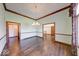 Chandelier-lit dining room with hardwood floors and detailed trim offers an elegant space at 563 E Greencastle Rd, Mooresville, IN 46158