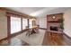 Cozy dining room area featuring hardwood floors, fireplace and natural light at 563 E Greencastle Rd, Mooresville, IN 46158