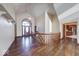 A grand entryway with hardwood floors, high ceilings, and a staircase offers a welcoming first impression at 563 E Greencastle Rd, Mooresville, IN 46158