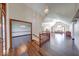 Elegant foyer featuring hardwood floors, a chandelier, and an open view of the living room at 563 E Greencastle Rd, Mooresville, IN 46158