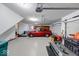 Spacious three car garage with epoxy floor, painted walls, and ample storage options at 563 E Greencastle Rd, Mooresville, IN 46158