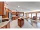 Open-concept kitchen with stainless steel appliances, breakfast bar, and eating nook for casual dining at 563 E Greencastle Rd, Mooresville, IN 46158