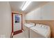Functional laundry room with washer, dryer and ample storage cabinets at 563 E Greencastle Rd, Mooresville, IN 46158