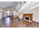 Spacious living room with fireplace, vaulted ceilings, and hardwood flooring is naturally lit at 563 E Greencastle Rd, Mooresville, IN 46158