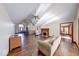 Bright living room with vaulted ceilings, fireplace, hardwood flooring, and natural light at 563 E Greencastle Rd, Mooresville, IN 46158