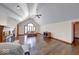 A bright living room with hardwood floors, a fireplace, and a ceiling fan offers ample space at 563 E Greencastle Rd, Mooresville, IN 46158