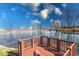 Scenic view of the property's pond with a wooden deck for relaxation and enjoying the natural surroundings at 563 E Greencastle Rd, Mooresville, IN 46158