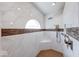 Luxurious walk-in shower featuring marble tile, mosaic accents, bronze hardware and a built-in bench at 563 E Greencastle Rd, Mooresville, IN 46158