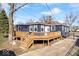 Charming home features a deck perfect for entertaining with a spacious, partially fenced backyard at 5884 Kingsley Dr, Indianapolis, IN 46220