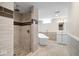 Updated bathroom features stylish tiling, a modern shower, and a luxurious soaking tub at 5884 Kingsley Dr, Indianapolis, IN 46220