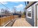 Spacious wood deck with wooden railings providing an outdoor living space to the home at 5884 Kingsley Dr, Indianapolis, IN 46220