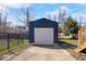 Detached garage provides parking and additional storage space on a fenced lot at 5884 Kingsley Dr, Indianapolis, IN 46220