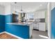 Bright eat-in kitchen features white cabinets, granite countertops, stainless steel appliances, and a breakfast bar at 5884 Kingsley Dr, Indianapolis, IN 46220