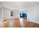 Open-concept living space with hardwood floors and a view into adjacent rooms at 5884 Kingsley Dr, Indianapolis, IN 46220