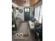 Charming entryway featuring a wooden ceiling, decorative accents, and a cozy daybed at 5951 W St Rd 32 W, Anderson, IN 46011