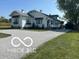 Charming, cottage-style home with gravel driveway and well-manicured lawn in a quiet, rural setting at 5951 W St Rd 32 W, Anderson, IN 46011