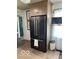 Spacious kitchen with stainless steel refrigerator, custom wood cabinets, and modern appliances at 5951 W St Rd 32 W, Anderson, IN 46011