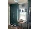 Laundry room featuring a storage cabinet, small table, and a window with natural light at 5951 W St Rd 32 W, Anderson, IN 46011