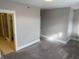 A sunlit bedroom provides a calm retreat, accented by the neutral walls and carpet at 614 E 11Th St, Indianapolis, IN 46202