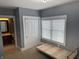 Bedroom featuring natural light, closet, and doorway to a bathroom at 614 E 11Th St, Indianapolis, IN 46202