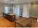 An open kitchen with stainless appliances and a functional kitchen island at 614 E 11Th St, Indianapolis, IN 46202