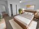 Cozy bedroom showcasing a comfortable bed, wood furniture, and a neutral color scheme at 6512 Buttonwood Dr, Noblesville, IN 46062