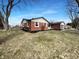 Charming red brick home with manicured lawn and mature trees at 6512 Buttonwood Dr, Noblesville, IN 46062