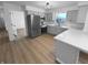 Modern kitchen featuring stainless steel appliances, light gray cabinetry, and sleek countertops at 6512 Buttonwood Dr, Noblesville, IN 46062