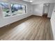Bright living room with new flooring, large window and neutral color palette at 6512 Buttonwood Dr, Noblesville, IN 46062