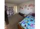 Bedroom with carpet, a closet, one bed, and lots of decor at 6812 Cadwell Cir, Indianapolis, IN 46237