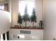Charming entryway display with trees, rocks, and a decorative bear statue at 6812 Cadwell Cir, Indianapolis, IN 46237
