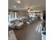 Spacious living room with modern decor, lots of light, and view into eat-in kitchen at 6812 Cadwell Cir, Indianapolis, IN 46237