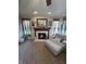 A living room with neutral colors, a fireplace, and lots of natural light at 6812 Cadwell Cir, Indianapolis, IN 46237