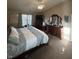 Inviting main bedroom offers neutral color palette and bright natural light at 6812 Cadwell Cir, Indianapolis, IN 46237